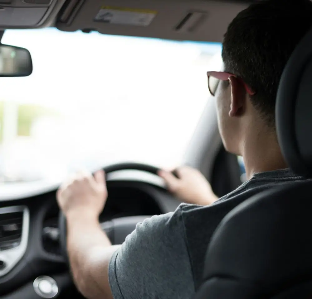 Action shot of a man driving a car